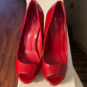 Open toe red pumps